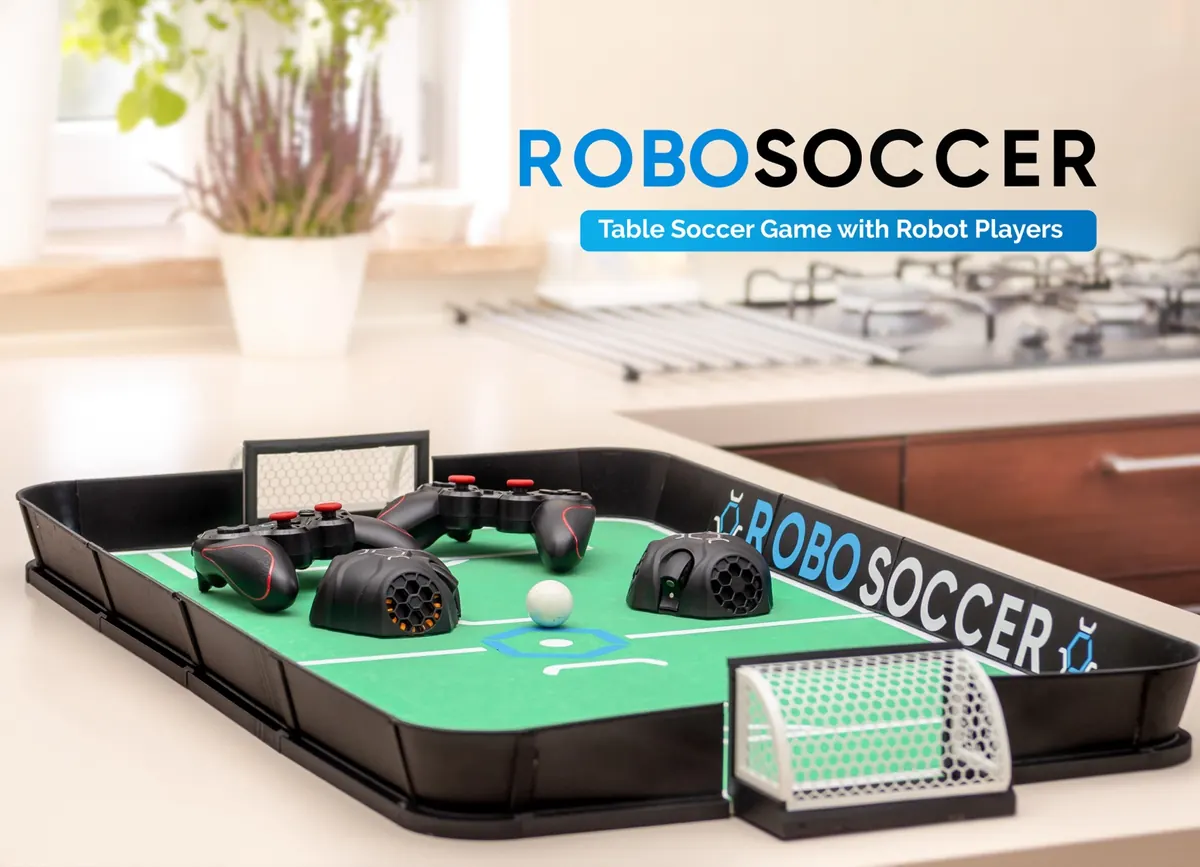 RoboSoccer — the table soccer game with two robot players, gamepads, and LED goals on a kitchen table